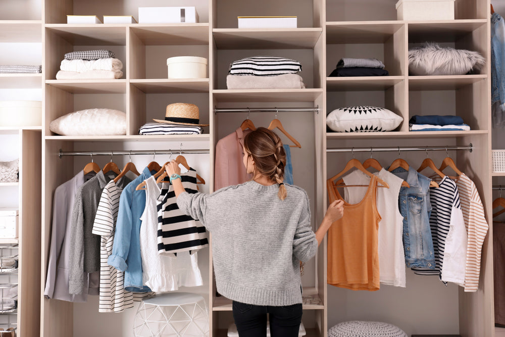 woman organizing wardrobe