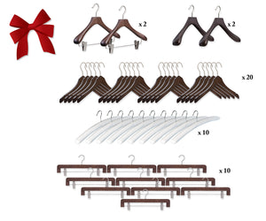 Set of wooden hangers with a red bow on a white background