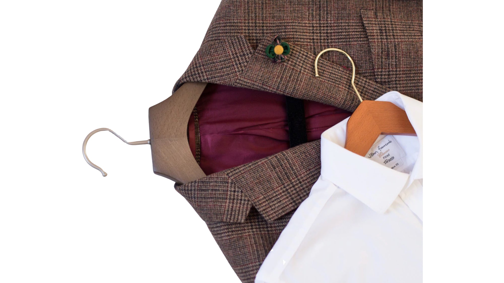 Brown plaid jacket with a hanger and white shirt inside, on a white background