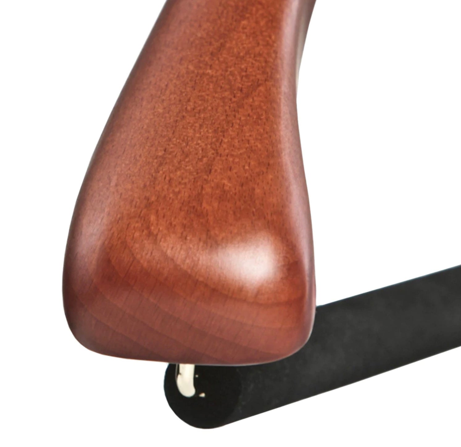 Close-up of a wooden hanger on a white background