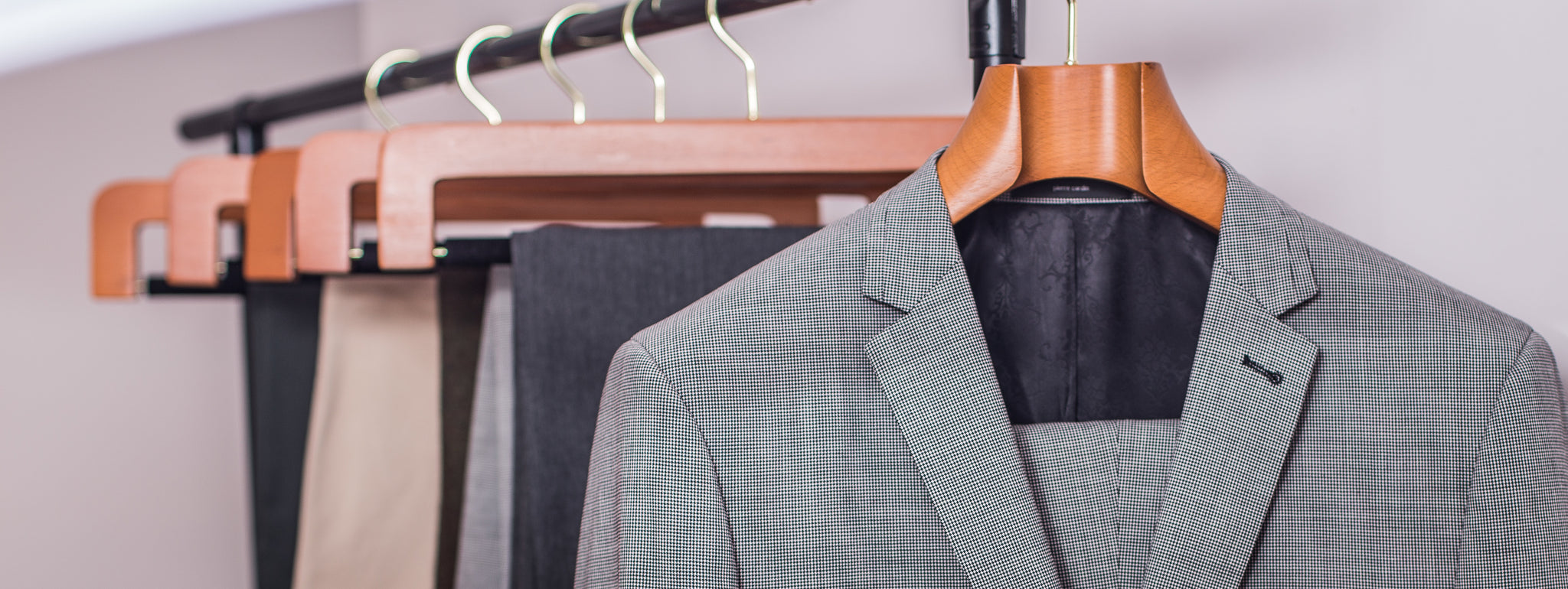 5 Ways Cheap Hangers Are Absolutely Ruining Your Suits - Butler Luxury